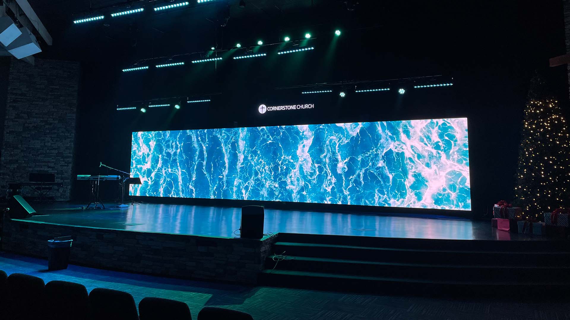 LED Display Buying Guide 1 - LED Display Price - LED Display Price Indoor LED wall displaying ocean imagery on a stage